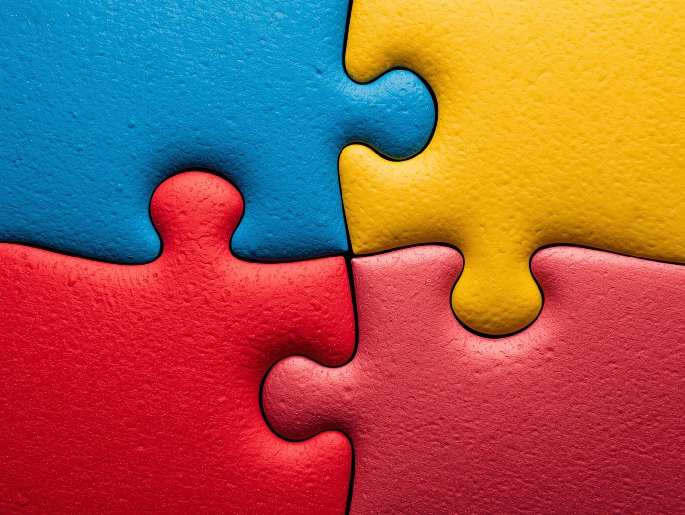 Morceaux de puzzle de 4 couleurs représentant l'autisme